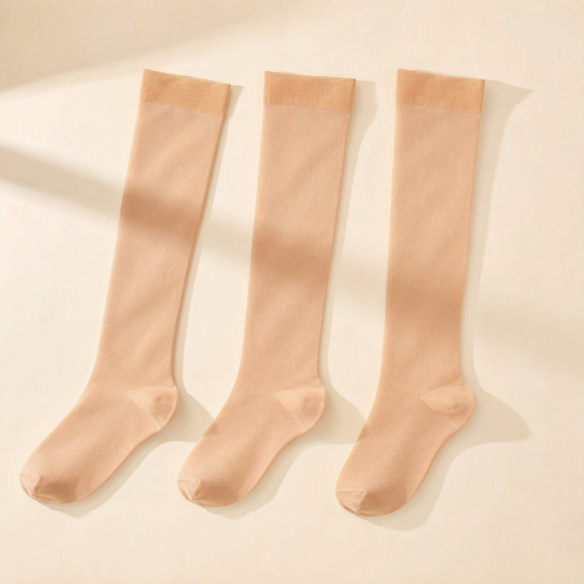 High-top nylon compression stockings with a solid-color design